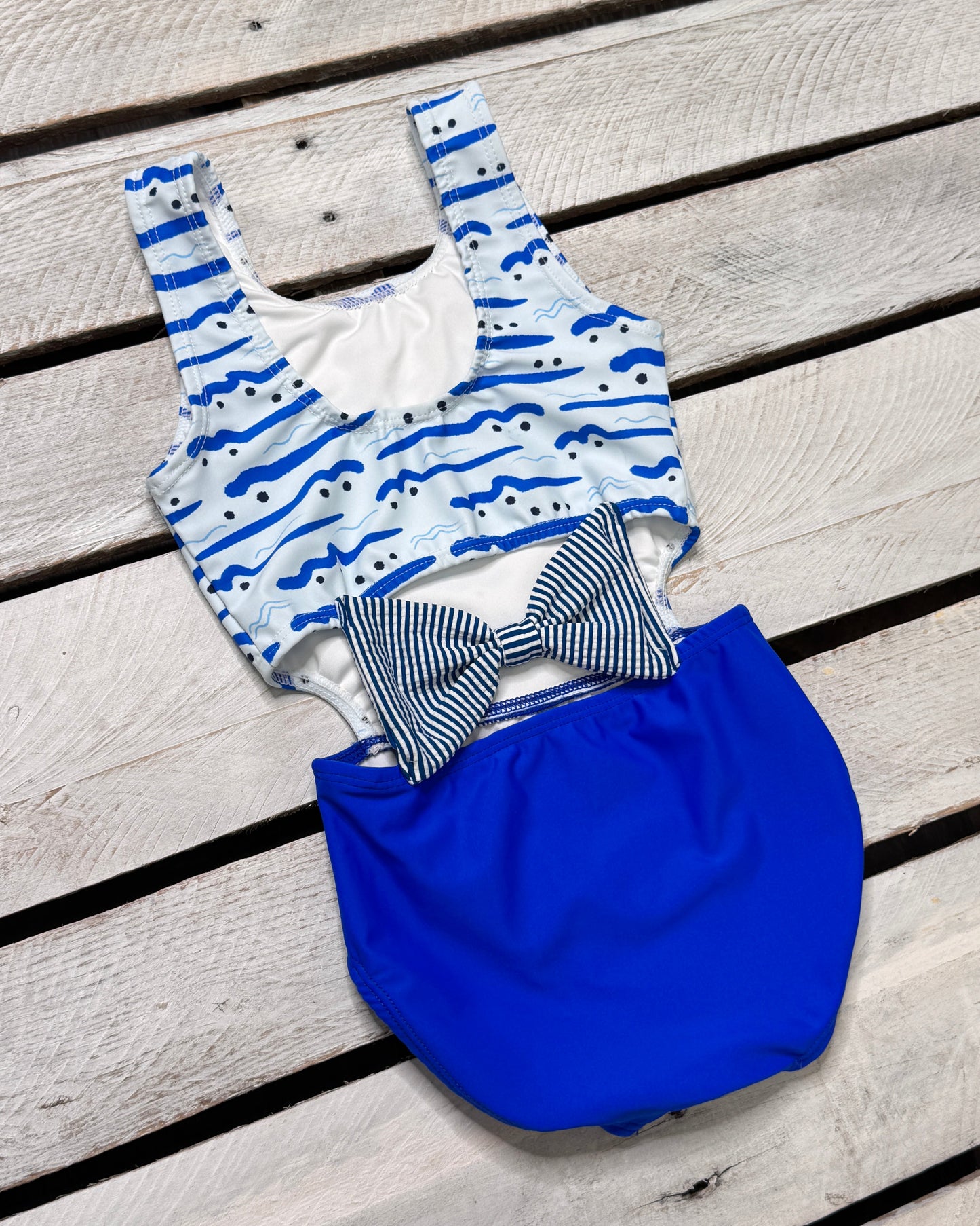 Cute toddler and children's swimwear. Matching sibling swim suit collections. UPF 50 Fabric. Made in the USA!
