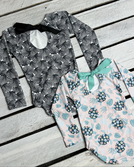 Cute toddler and children's swimwear. Matching sibling swim suit collections. UPF 50 Fabric. Made in the USA!