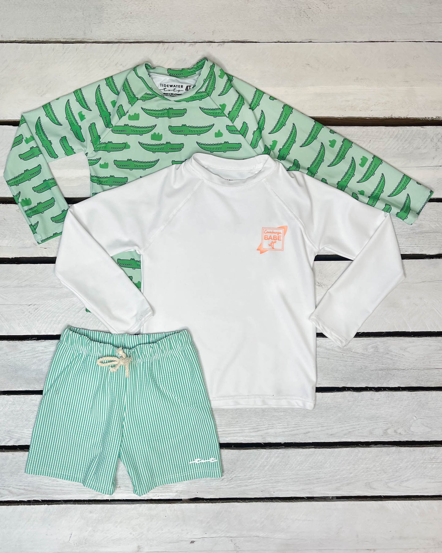 Cute toddler and children's swimwear. Matching sibling swim suit collections. UPF 50 Fabric. Made in the USA!