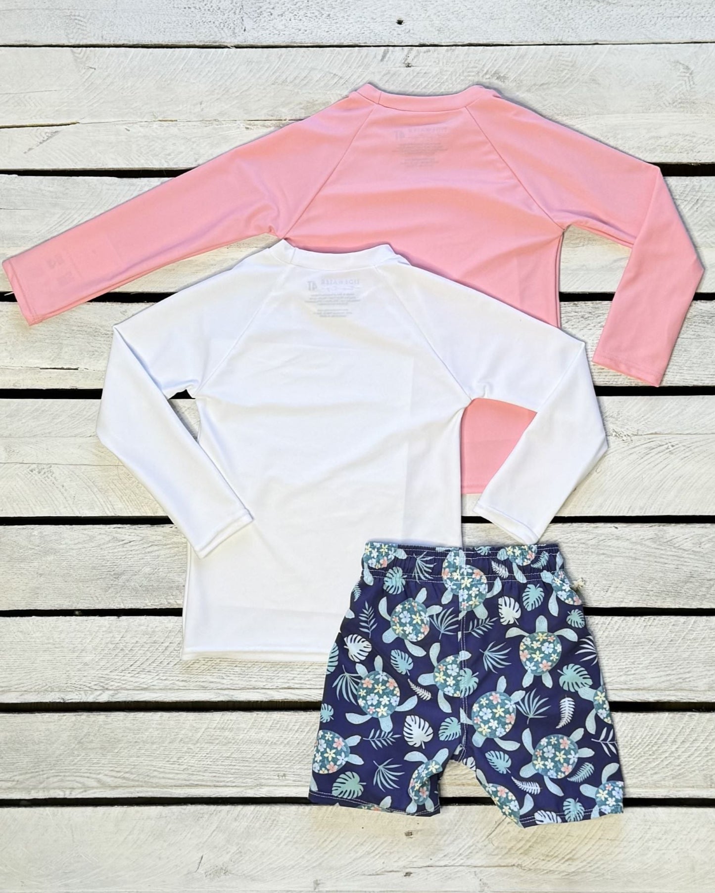 Cute toddler and children's swimwear. Matching sibling swim suit collections. UPF 50 Fabric. Made in the USA!