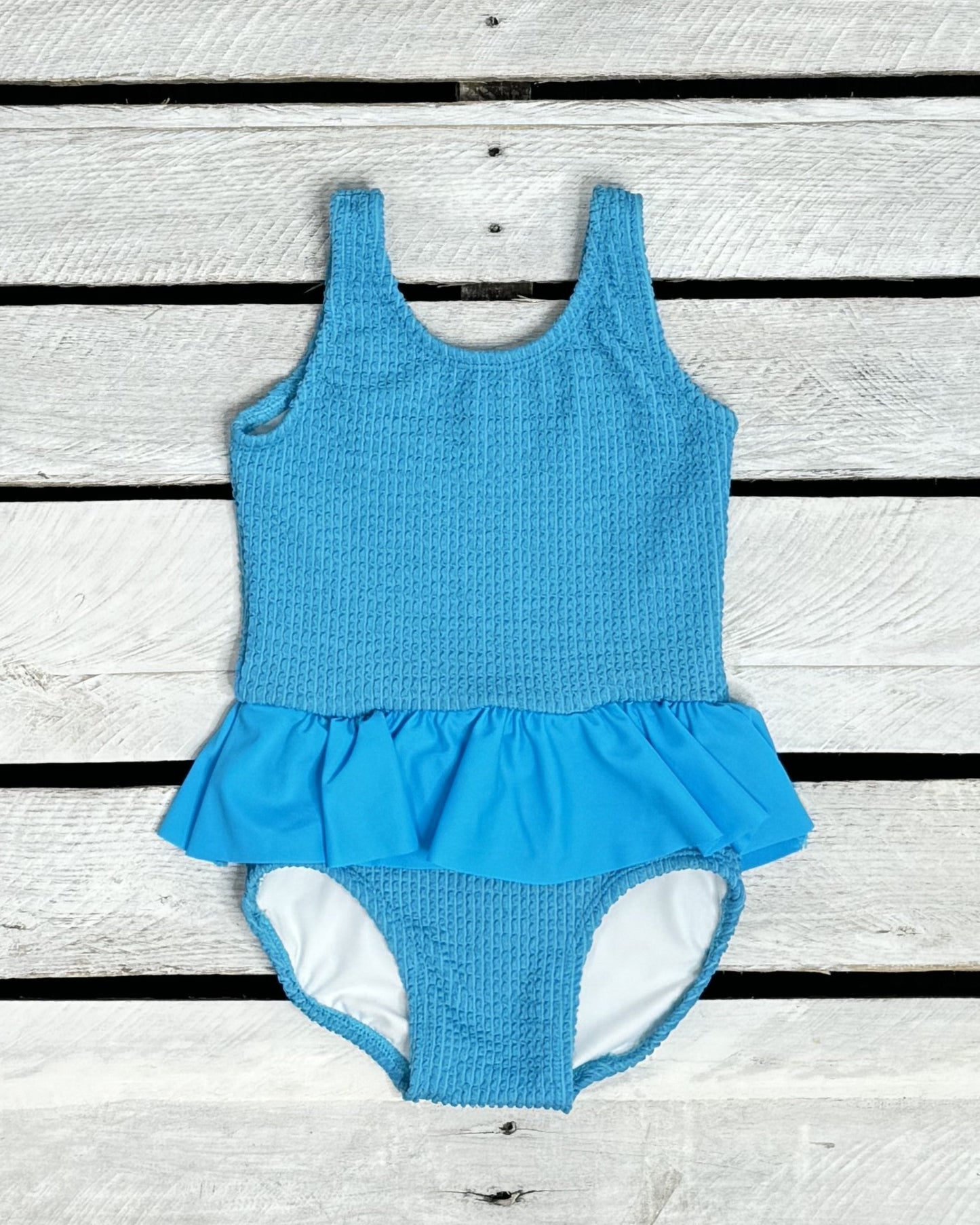 Cute toddler and children's swimwear. Matching sibling swim suit collections. UPF 50 Fabric. Made in the USA!