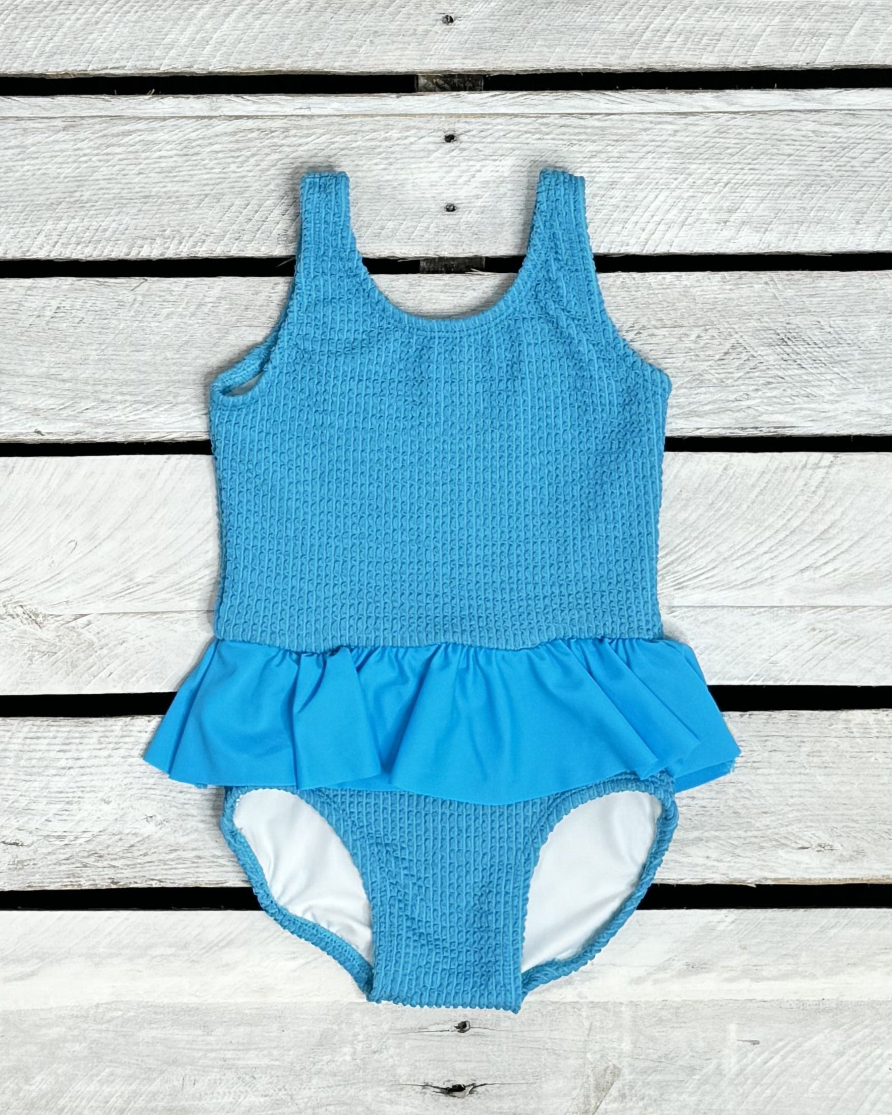 Cute toddler and children's swimwear. Matching sibling swim suit collections. UPF 50 Fabric. Made in the USA!